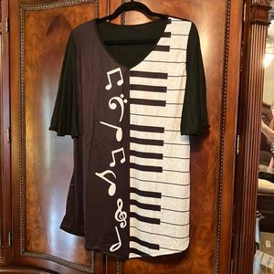 Lightweight Music themed top. Cotton and polyester mixed fabric. Longer in front